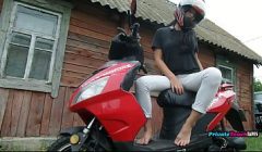 Russian biker girl plays with her wet pussy outdoors.
