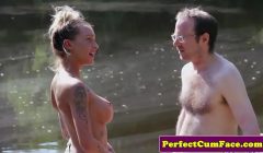 Busty femdom tugging guy outdoors for spunk