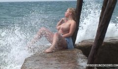 Busty teen Malina get wetting in waves