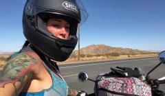 felicity feline riding on aprilia tuono motorcycle