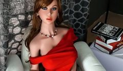 Mature brunette sex doll in long red dress