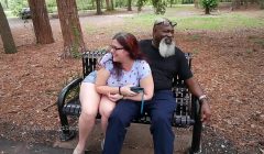 Nerdy Milf strokes and suck blk dick in the Park