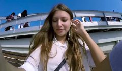 Talia Mint plays in public with remote control toy over the phone with fan